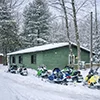 Snowmobiles parked outside the winter lodging